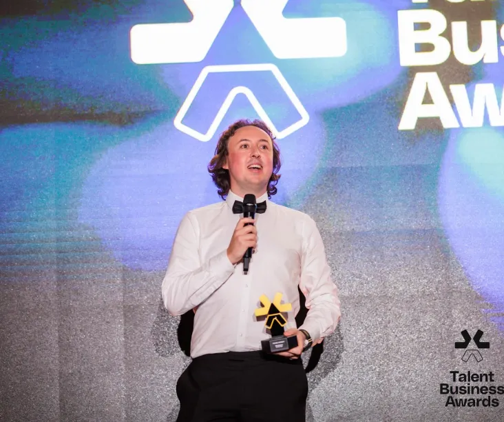CEO of The Bee Academy taking the award for DEI Initiative of the year