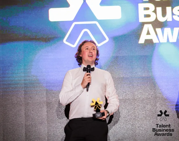 CEO of The Bee Academy taking the award for DEI Initiative of the year